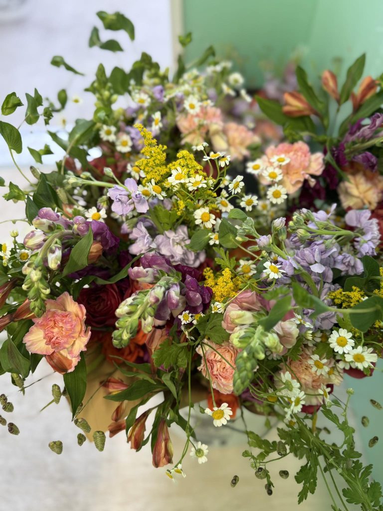 a photograph of spring florals in a market wrap